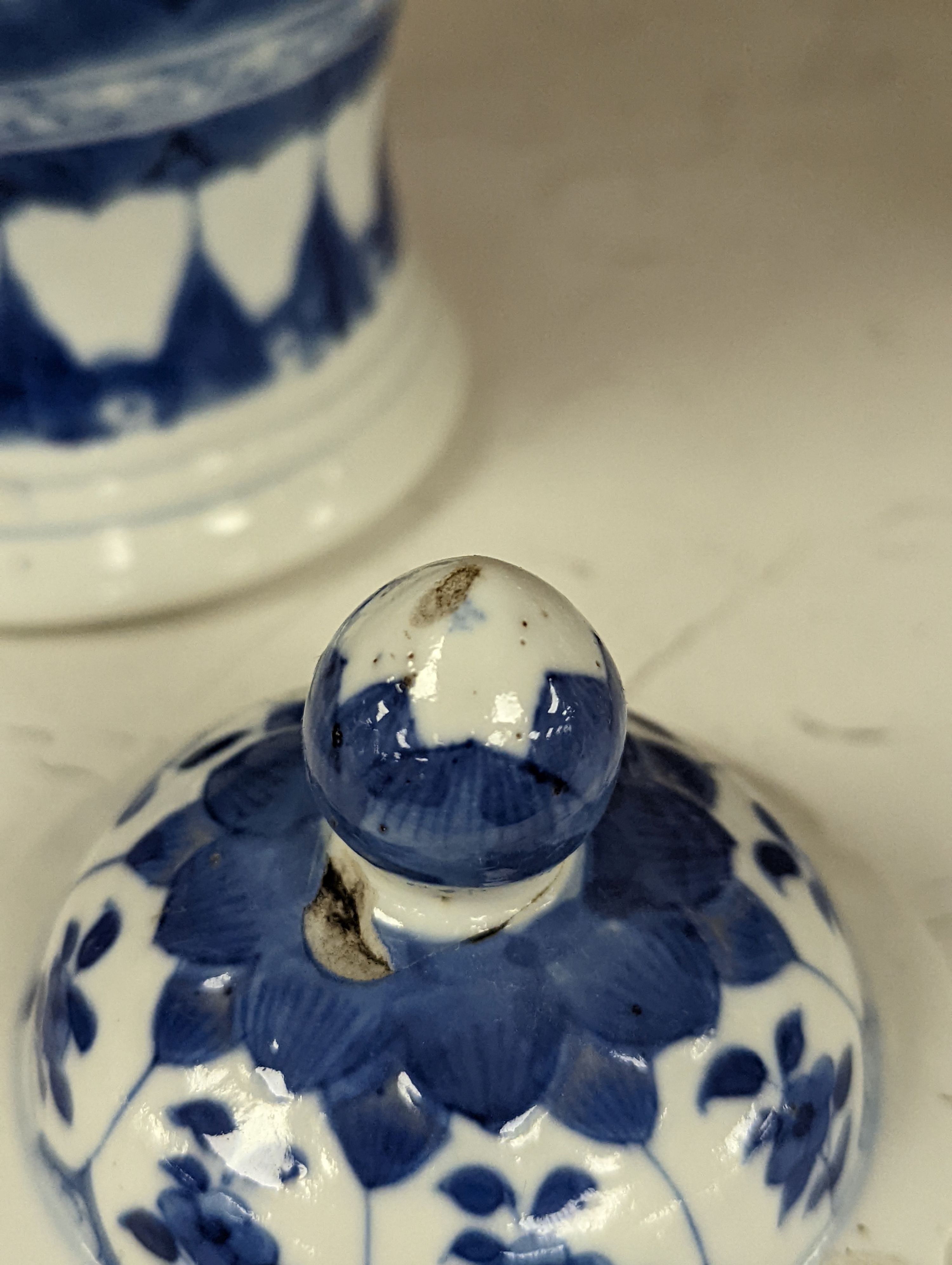 A Chinese blue and white vase and cover, Kangxi mark, 19th century, 26.5cm tall, and a Chinese Kangxi period small vase (2)